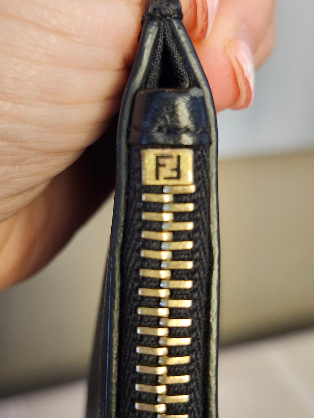Fendi Black Leather Monster Clutch with Gold Accents