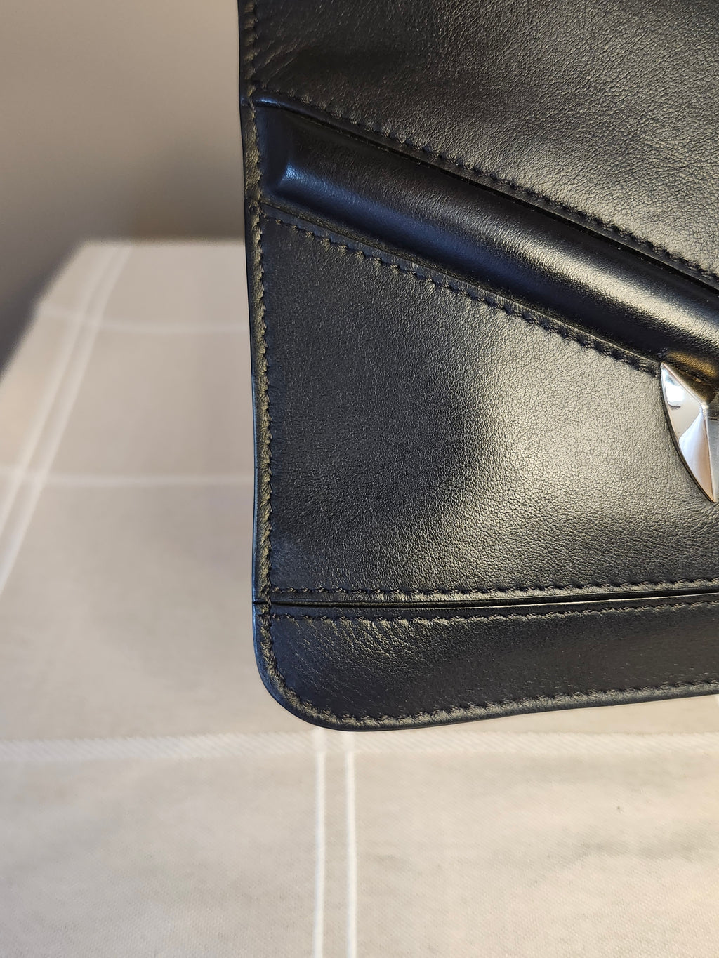 Fendi Black Leather Monster Clutch with Gold Accents