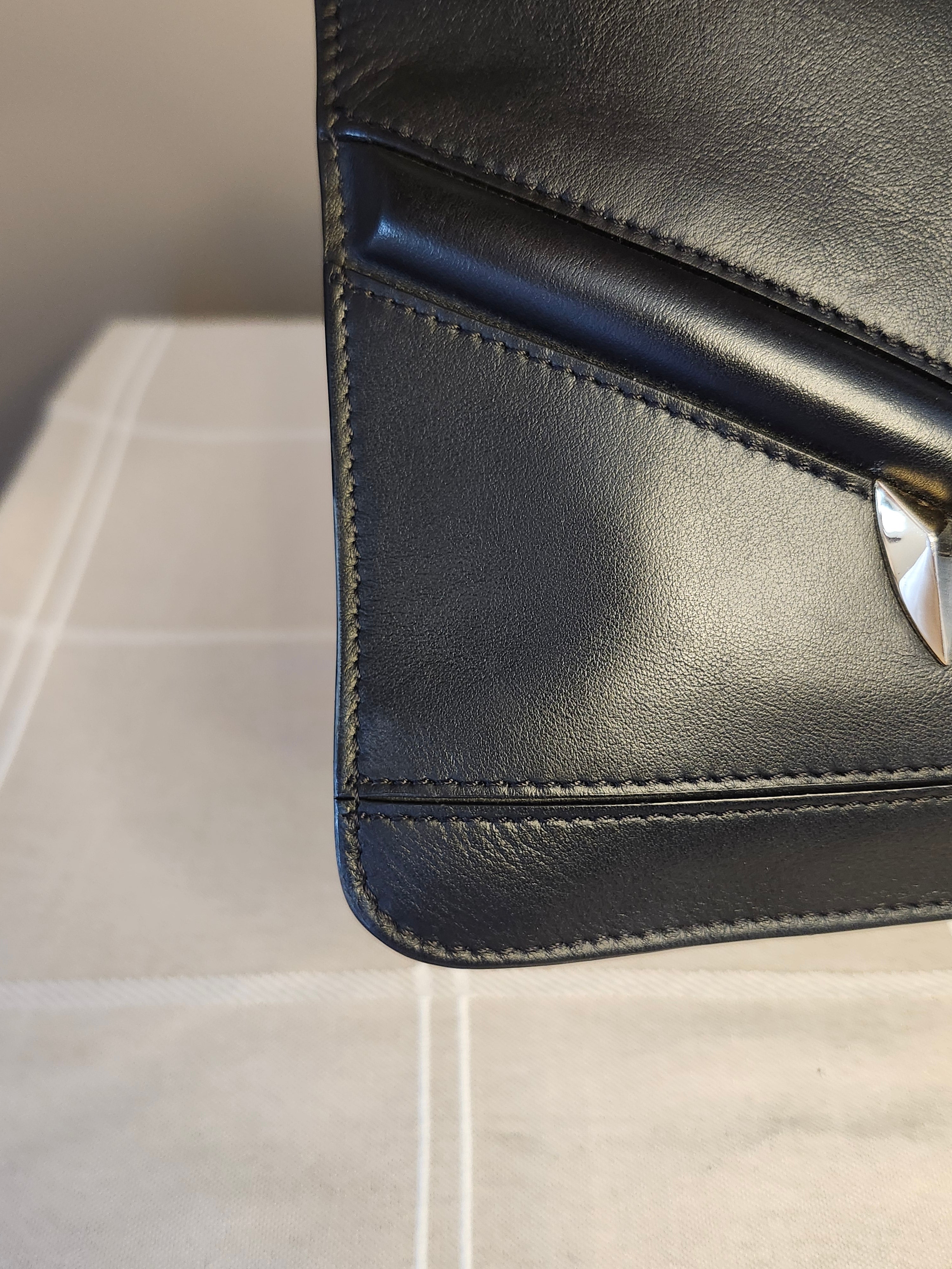 Fendi Black Leather Monster Clutch with Gold Accents