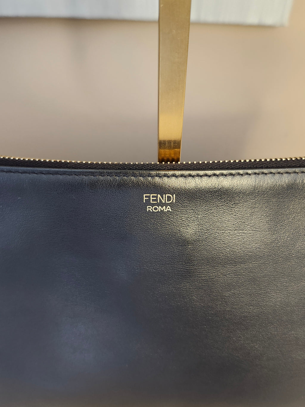 Fendi Black Leather Monster Clutch with Gold Accents