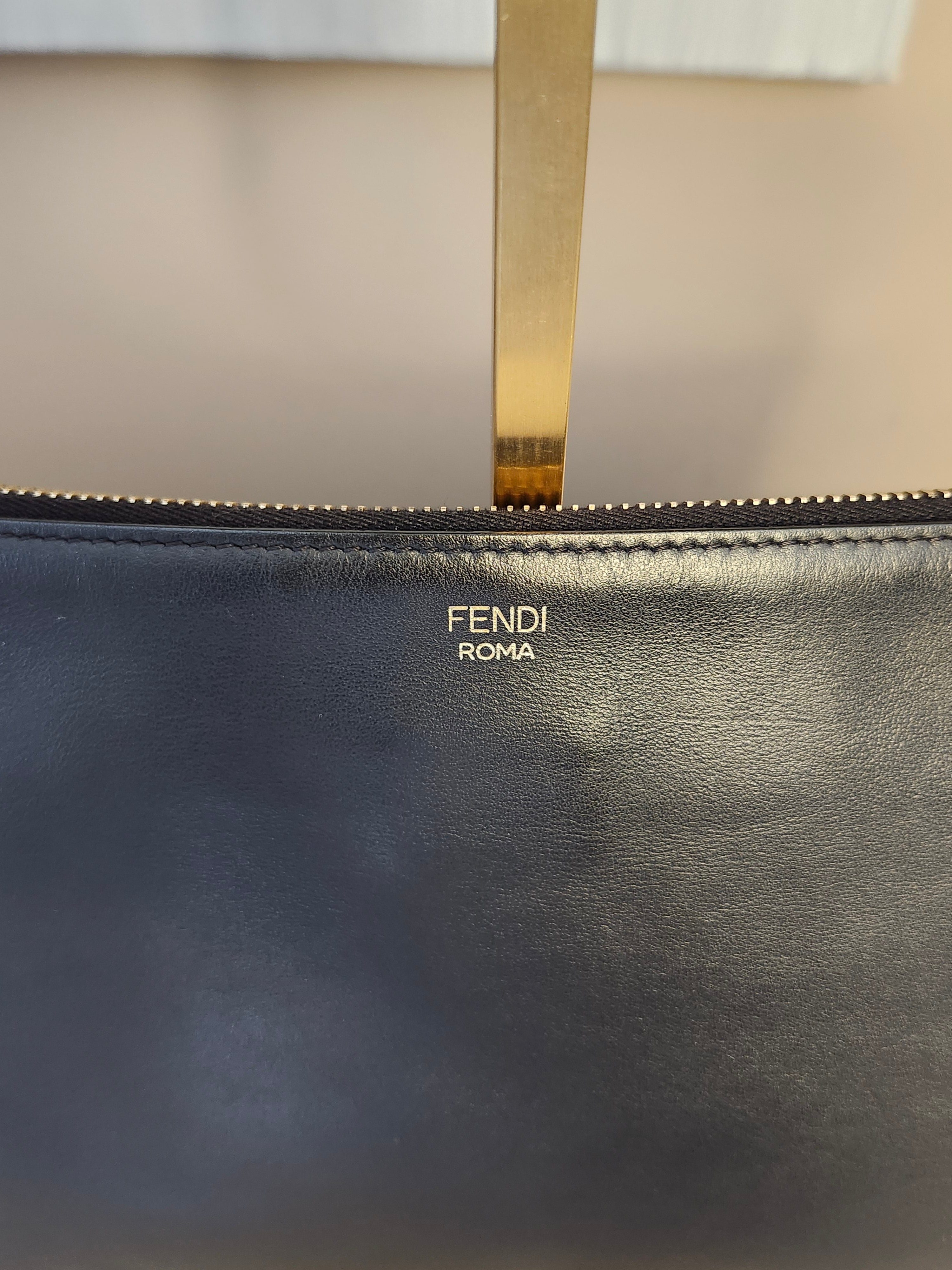 Fendi Black Leather Monster Clutch with Gold Accents