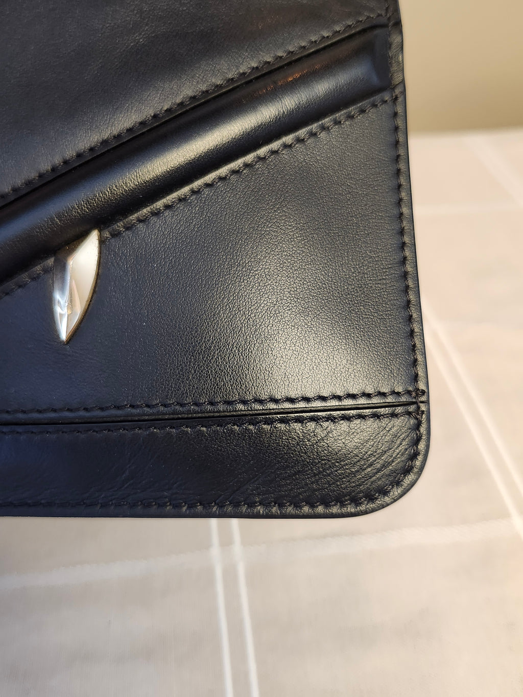 Fendi Black Leather Monster Clutch with Gold Accents